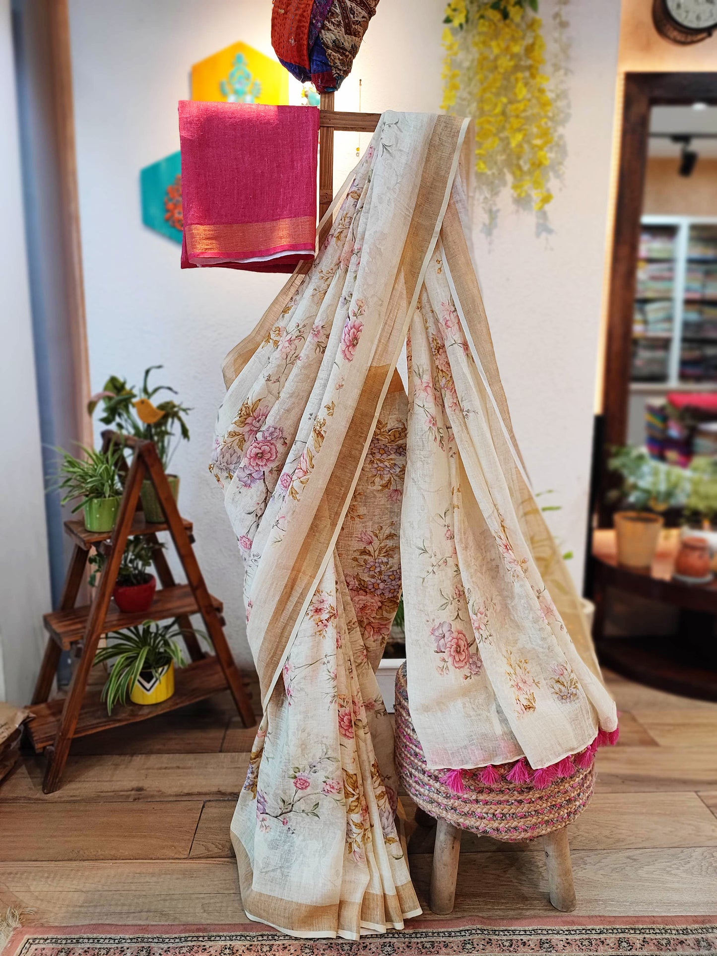 Cream Floral Print Linen Saree with Tassels & Contrasting Red Blouse