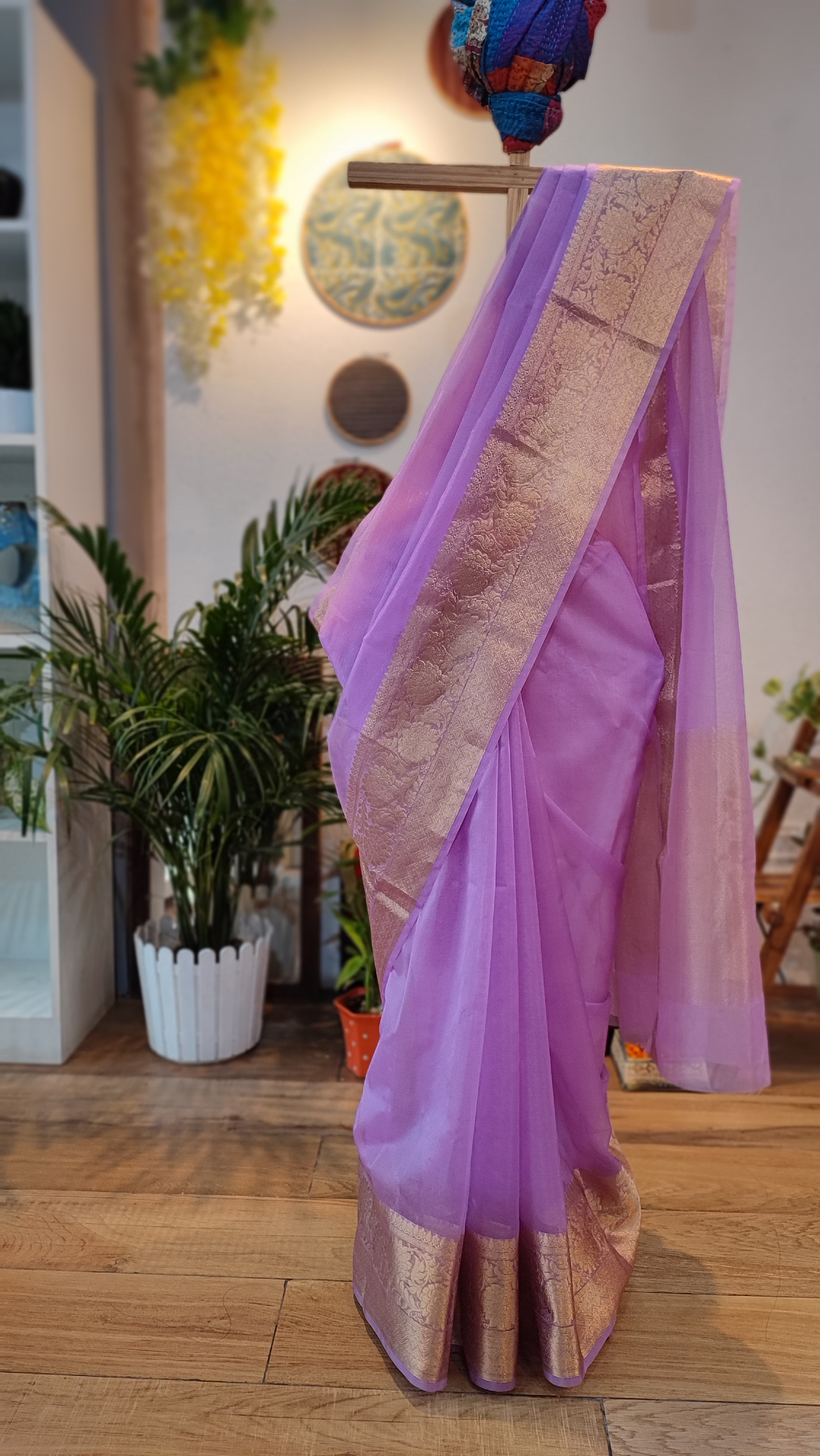 Priva Collective - Red Organza saree with golden zari buttis finished with  a zari border. Price - Rs 5000 Saree comes with unstitched blouse piece.  Its a golden paithani blouse piece. For