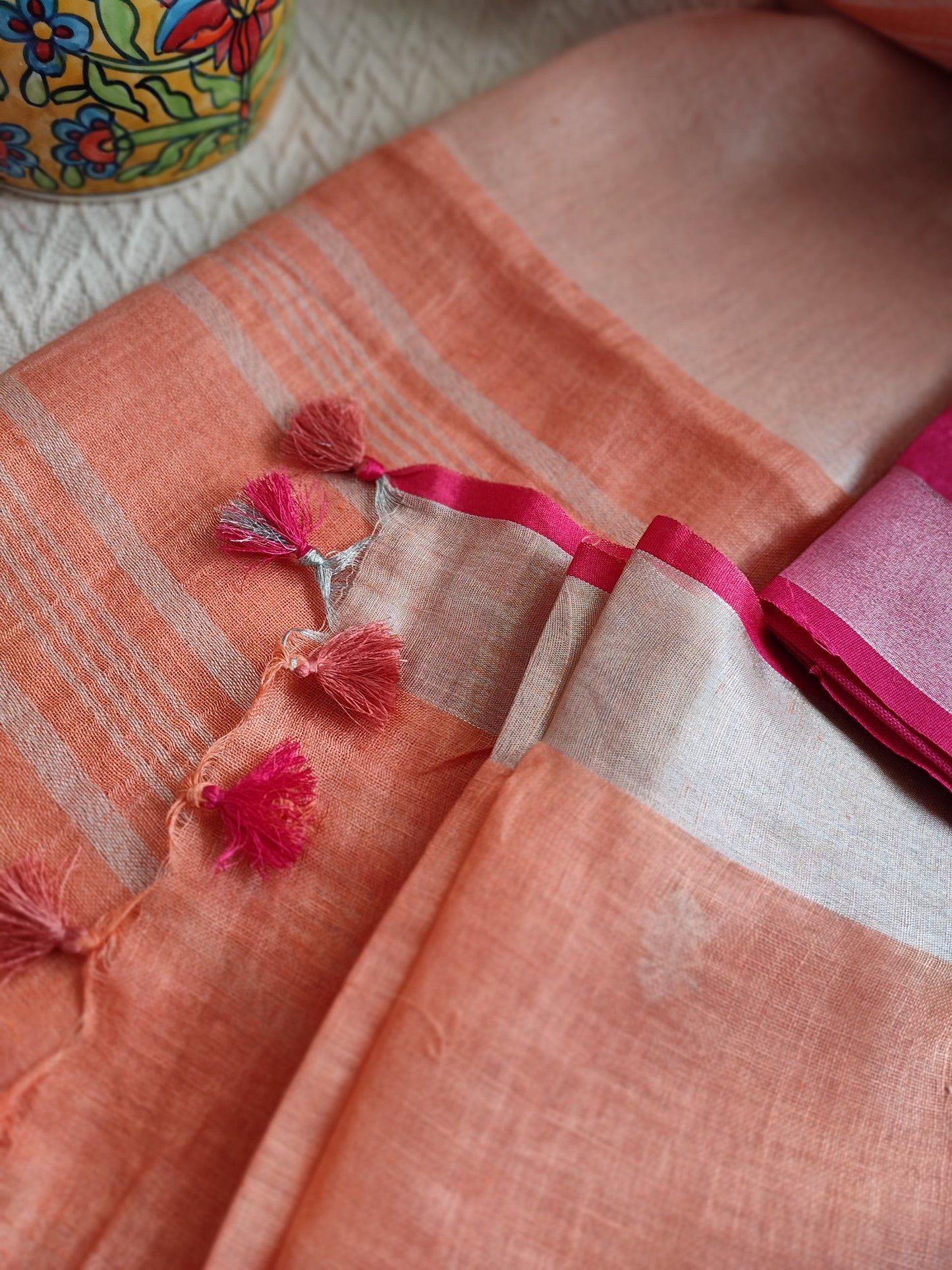 Peach Pure Linen Embroidered Saree with Tassels Detailing and Hot Pink Blouse